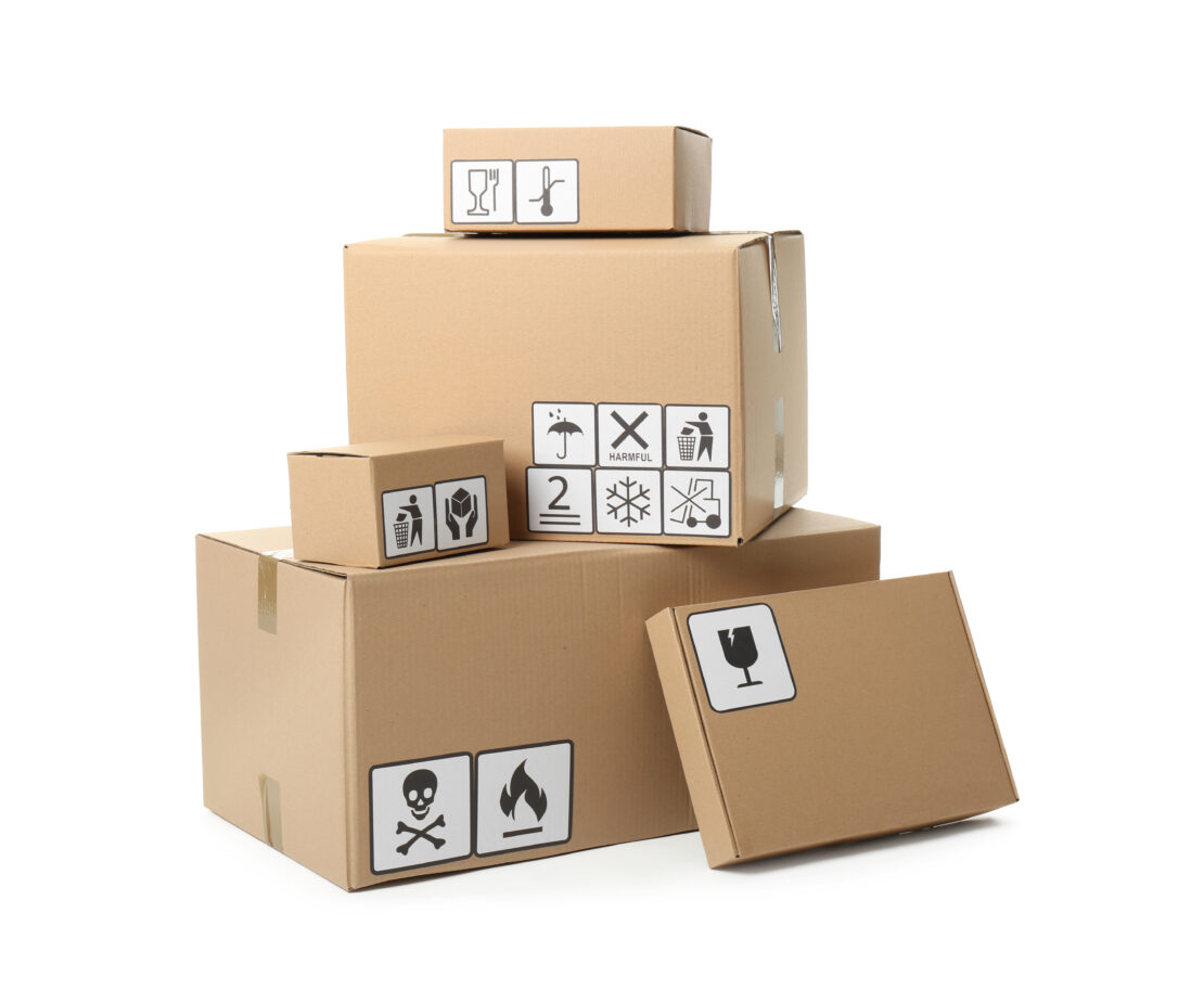 Cardboard boxes with different packaging symbols