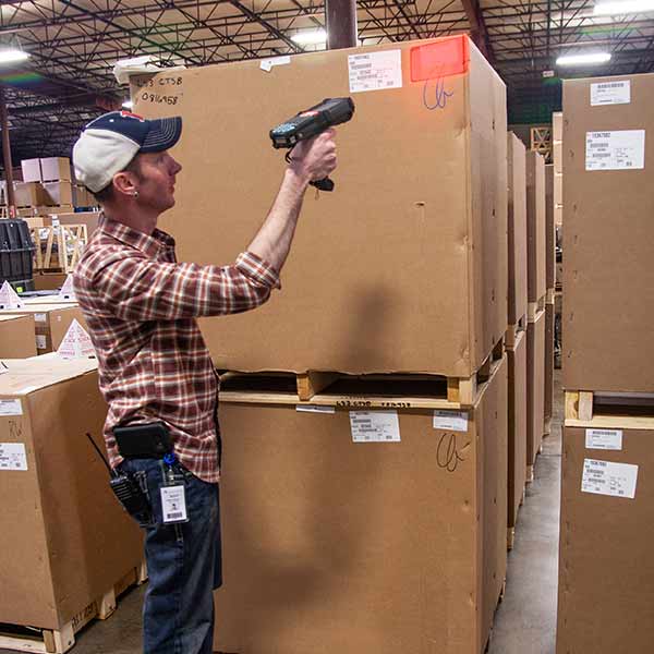 Man scanning a box